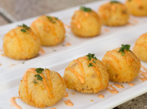 hush puppy patty with spicy mayo drizzle