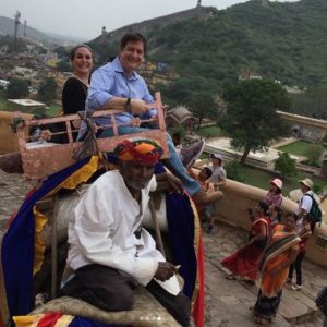 Naomi riding an elephant in India